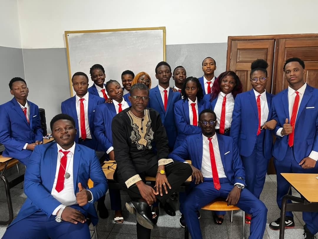 Group of Douala students and teacher in classroom